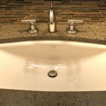 Oblique Lavatory and Faucet in vanity with granite top