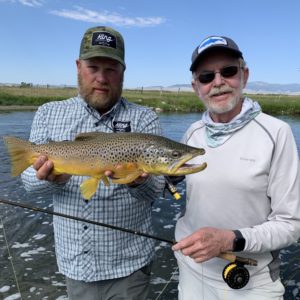 Dave King of King Outfitters prepares to release the author's 22-inch brown trout.