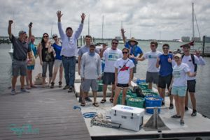 Sarasota Bay Watch members and volunteers celebrate one of their 2018 clam releases. - Rusty Chinnis | Sun